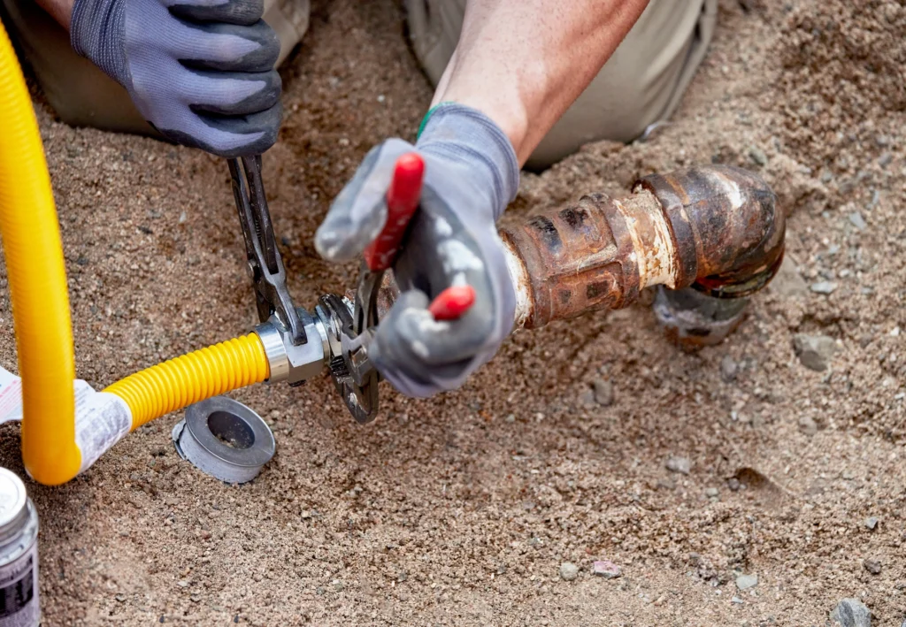 Technician Installing Buried Gas Line
