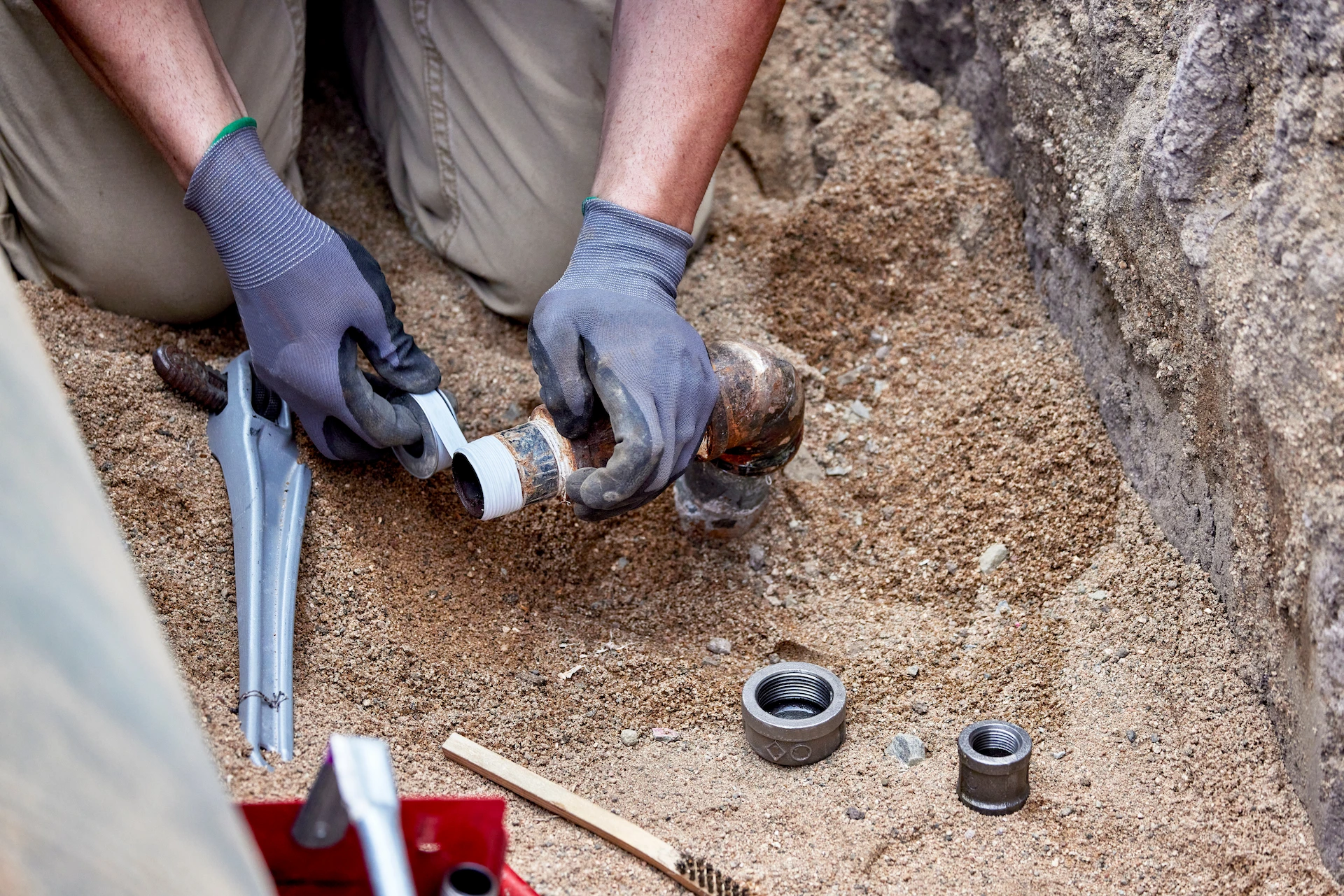 Technician Affixing new buried gas line